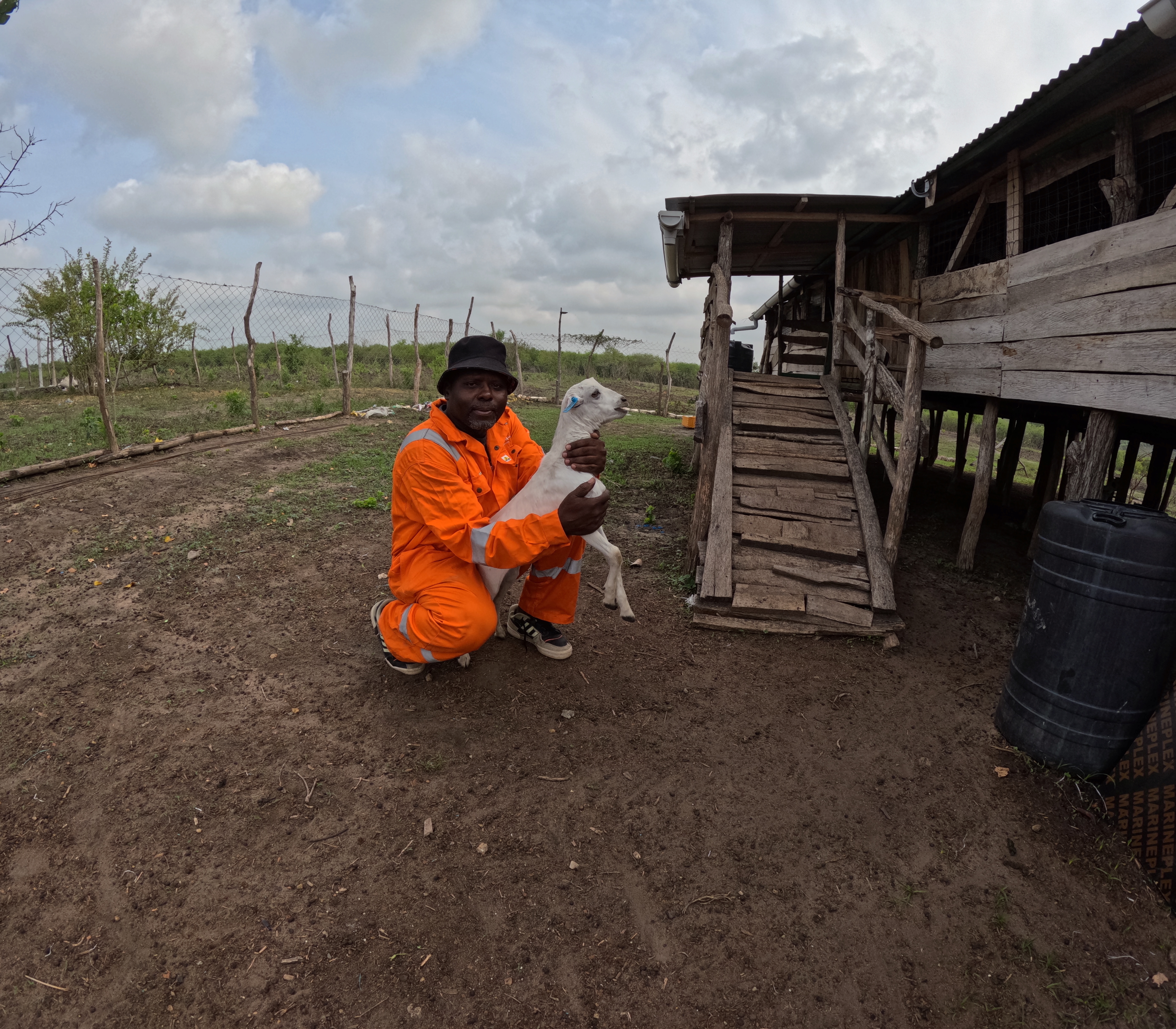 Farm manager with a young kid during a welfare check at Keragita Farms.